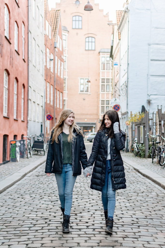 Two young ladies walk down a street in Copenhagen from a blog post about How the Minimalist Mindset Changed My Life by Chelsey Home