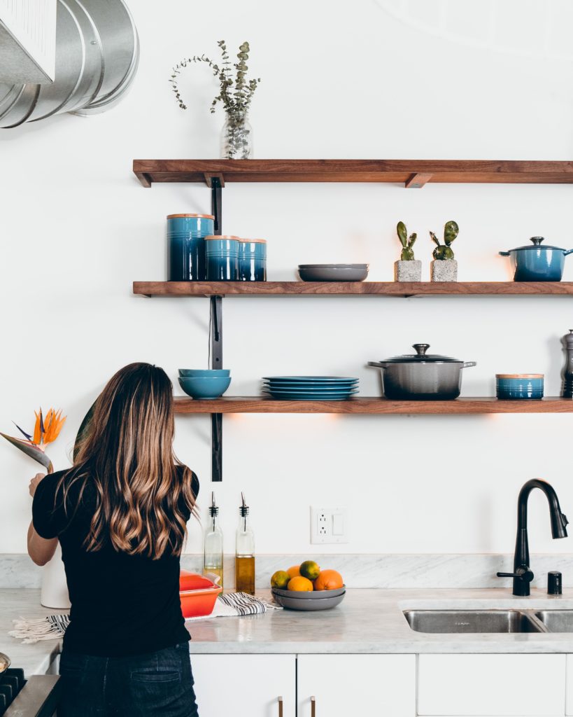 Blue Le Creuset Cookware Displayed on Open Kitchen Shelves - Modern Minimalist Kitchen Ideas